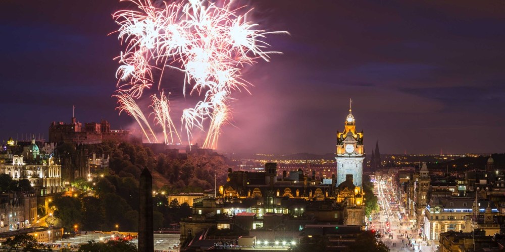 a view of a city with fireworks in the sky