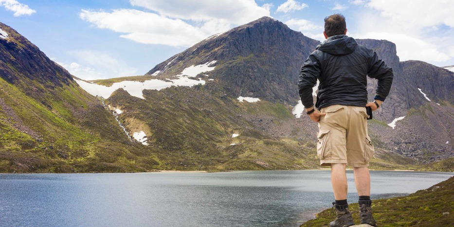 a man riding on top of a mountain